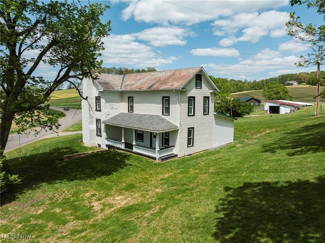 3153 SW Boltz Orchard Rd, Sugarcreek, OH 44681 - rear view of property featuring a porch, a chimney, and a yard