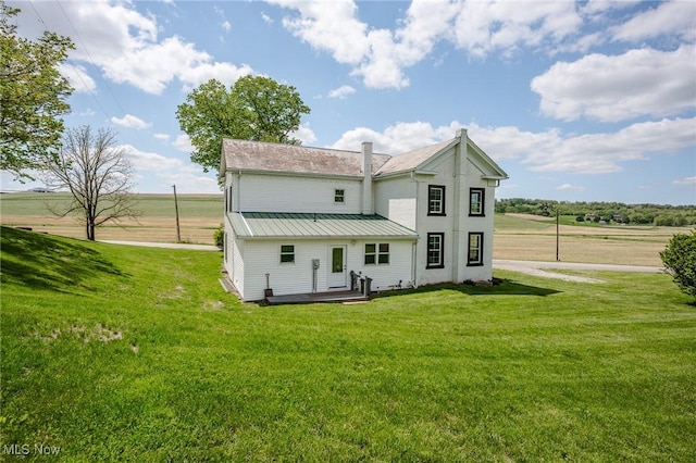 3153 SW Boltz Orchard Rd, Sugarcreek, OH 44681 - back of property featuring a yard, metal roof, and a standing seam roof