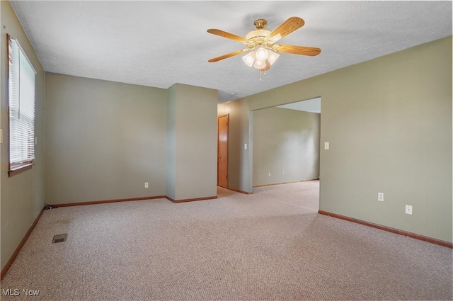 12395 Carter Rd, Concord, OH 44077 - carpeted spare room with a ceiling fan and baseboards