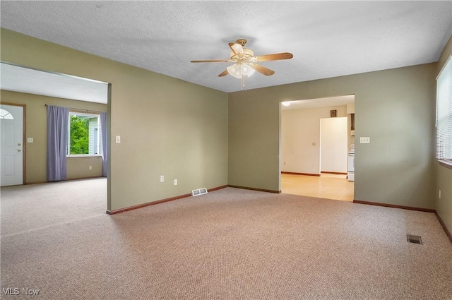 12395 Carter Rd, Concord, OH 44077 - unfurnished room featuring ceiling fan, light colored carpet, and baseboards