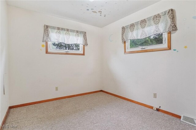 12395 Carter Rd, Concord, OH 44077 - carpeted spare room featuring baseboards