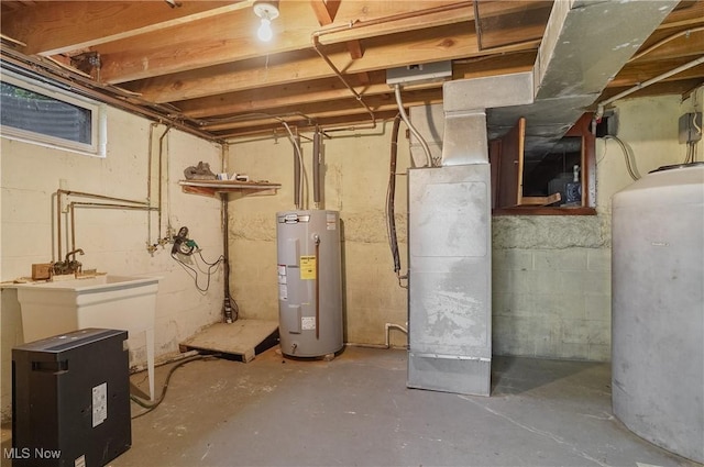 12395 Carter Rd, Concord, OH 44077 - unfinished below grade area featuring water heater and oil tank