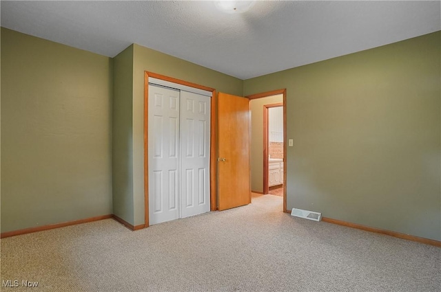 12395 Carter Rd, Concord, OH 44077 - unfurnished bedroom with baseboards, a closet, and carpet floors