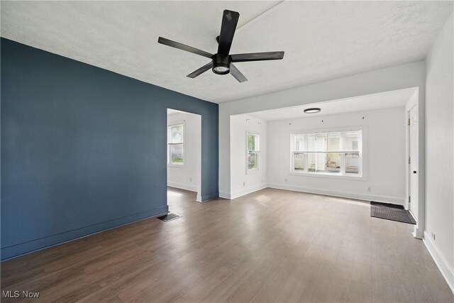 423 Kansas Ave, Lorain, OH 44052 - spare room featuring wood finished floors, a ceiling fan, and baseboards