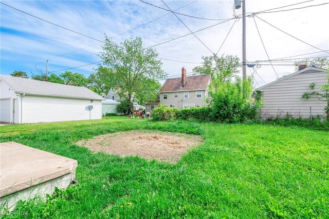 423 Kansas Ave, Lorain, OH 44052 - view of yard with a detached garage