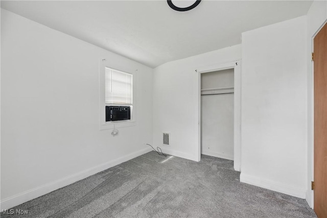 423 Kansas Ave, Lorain, OH 44052 - unfurnished bedroom featuring carpet, baseboards, cooling unit, and a closet