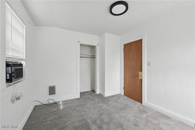 423 Kansas Ave, Lorain, OH 44052 - unfurnished bedroom with carpet, baseboards, a closet, and cooling unit