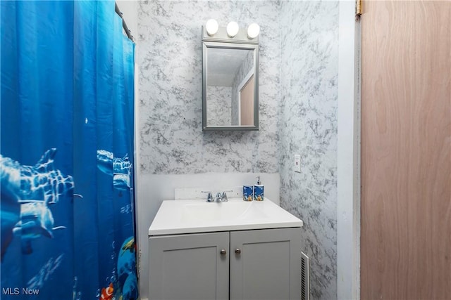 423 Kansas Ave, Lorain, OH 44052 - bathroom featuring vanity, wallpapered walls, and a shower with curtain