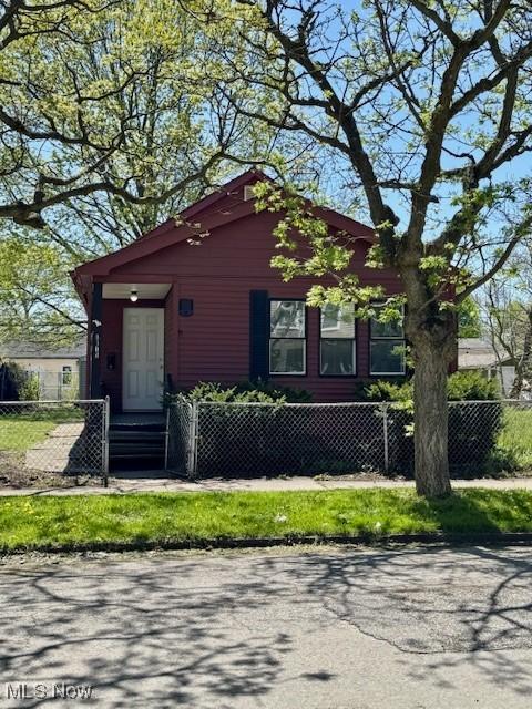 6815 Lawn Ave, Cleveland, OH 44102 - view of front facade featuring a fenced front yard