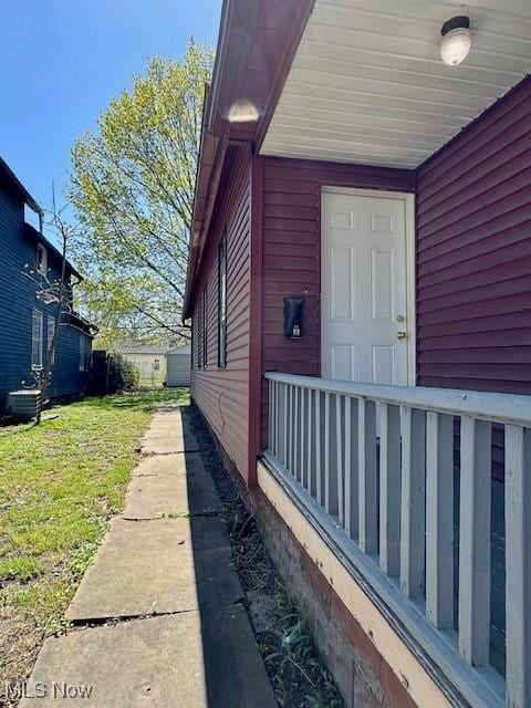 6815 Lawn Ave, Cleveland, OH 44102 - entrance to property featuring central AC unit and a lawn