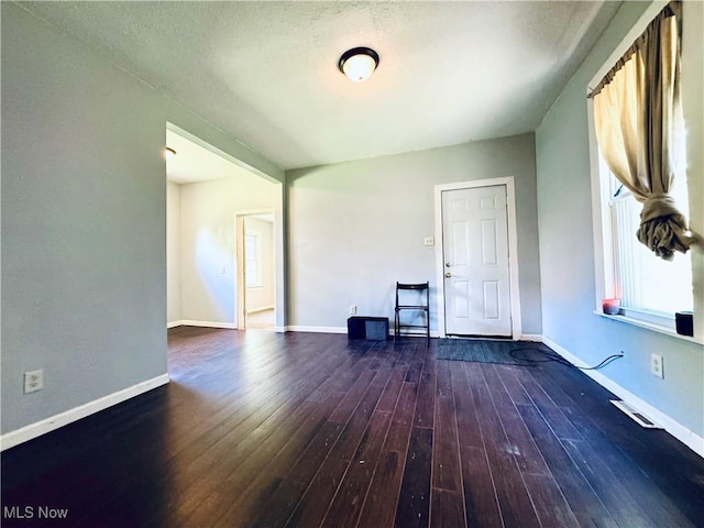 6815 Lawn Ave, Cleveland, OH 44102 - spare room with wood-type flooring and baseboards