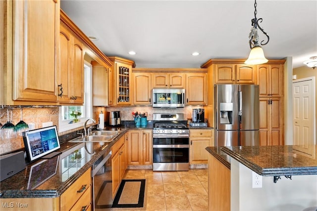6868 Twin Oaks Ct, Canfield, OH 44406 - kitchen with stainless steel appliances, a sink, recessed lighting, backsplash, and glass insert cabinets