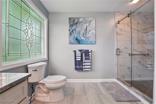 6868 Twin Oaks Ct, Canfield, OH 44406 - bathroom with a shower stall, toilet, baseboards, and vanity