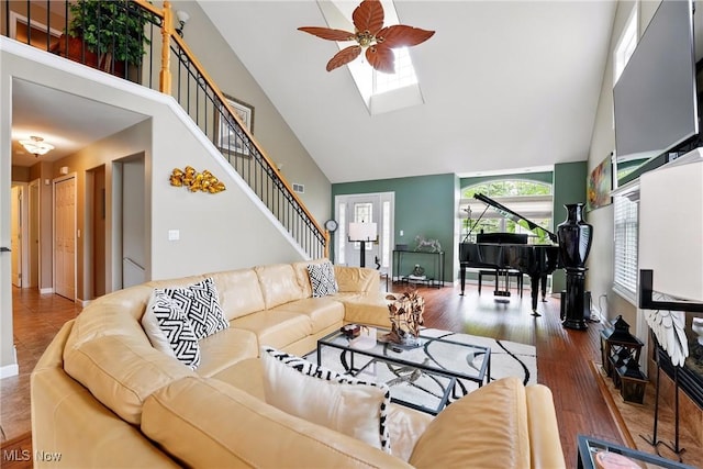 6868 Twin Oaks Ct, Canfield, OH 44406 - living area with high vaulted ceiling, ceiling fan, a skylight, wood finished floors, and stairs