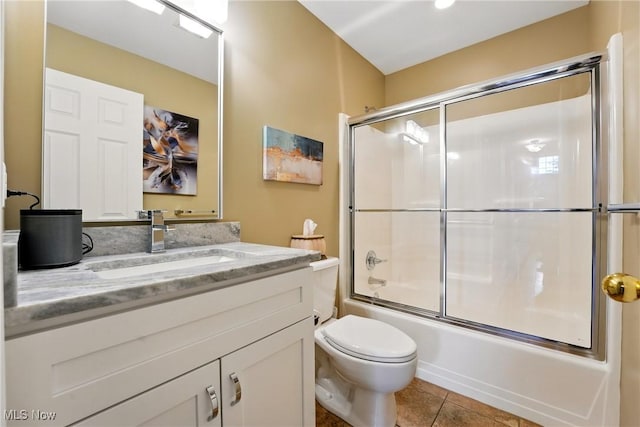 6868 Twin Oaks Ct, Canfield, OH 44406 - full bath featuring toilet, vanity, bath / shower combo with glass door, and tile patterned flooring