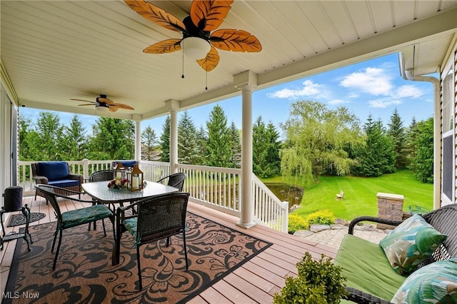 6868 Twin Oaks Ct, Canfield, OH 44406 - wooden terrace with a ceiling fan, view of wooded area, a yard, and outdoor lounge area