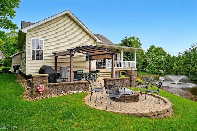 6868 Twin Oaks Ct, Canfield, OH 44406 - rear view of house with an outdoor fire pit, a yard, and a patio