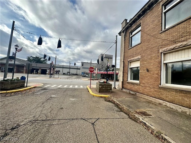 800 Main St, Follansbee, WV 26037 - view of asphalt road featuring traffic signs, curbs, street lighting, and sidewalks