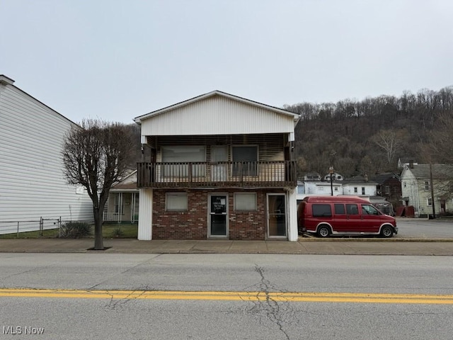 800 Main St, Follansbee, WV 26037 - view of front facade with a balcony and brick siding