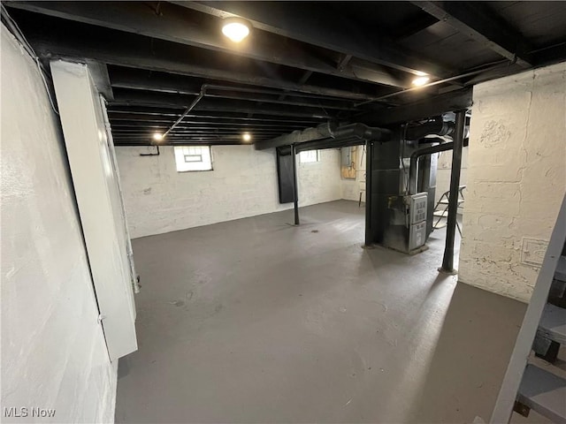 below grade area featuring heating unit