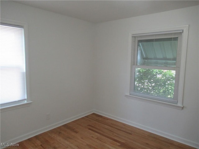 1397 Sunset Rd, Mayfield Heights, OH 44124 - unfurnished room with wood finished floors and baseboards