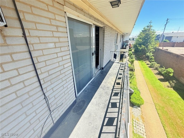view of patio featuring a balcony