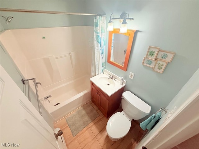 full bathroom with tile patterned flooring, shower / bath combo, toilet, and vanity