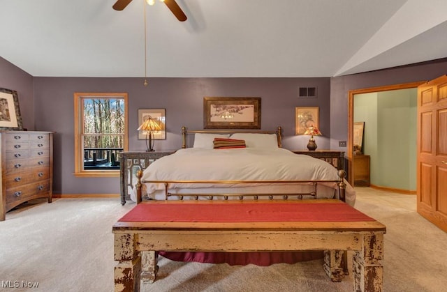 38 Choctaw Trl, Malvern, OH 44644 - bedroom with carpet floors, vaulted ceiling, and a ceiling fan