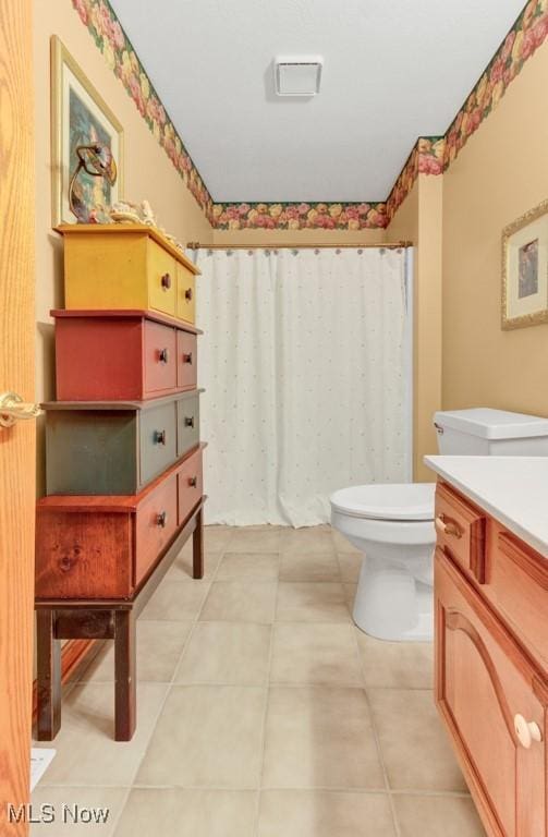 38 Choctaw Trl, Malvern, OH 44644 - full bathroom with vanity, a shower with shower curtain, and tile patterned flooring