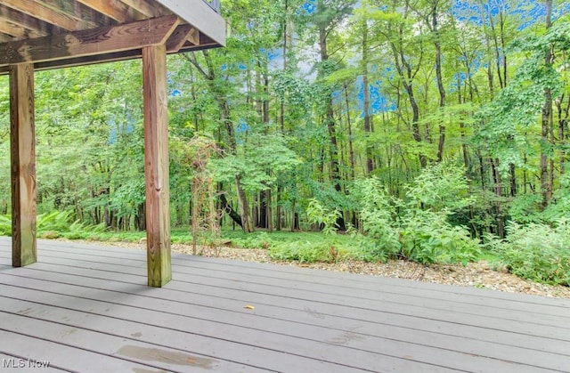 38 Choctaw Trl, Malvern, OH 44644 - wooden terrace with a wooded view