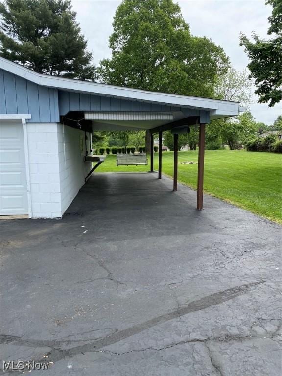 1912 Lisbon St, East Liverpool, OH 43920 - view of parking / parking lot featuring a carport and driveway