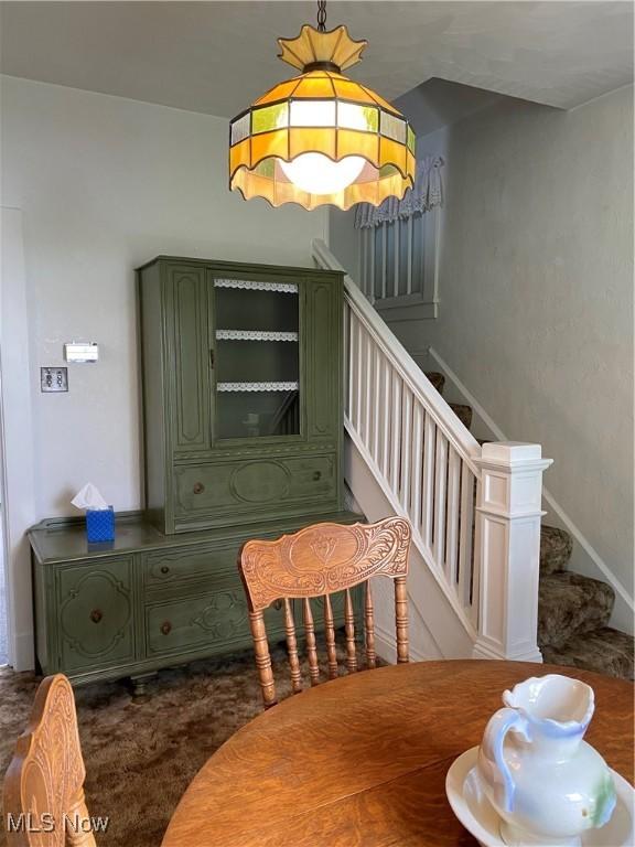 1912 Lisbon St, East Liverpool, OH 43920 - dining space with carpet flooring and stairway