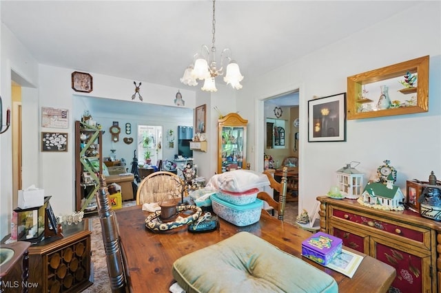 dining area featuring a chandelier and wood finished floors