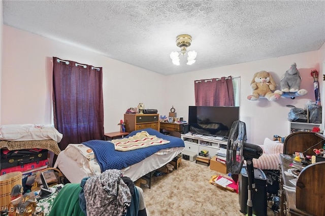 bedroom featuring a textured ceiling and a chandelier