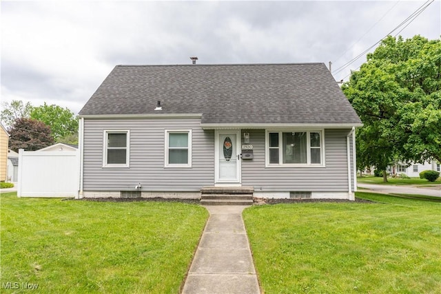 2930 Archwood Pl, Cuyahoga Falls, OH 44221 - cape cod-style house featuring a front lawn and roof with shingles