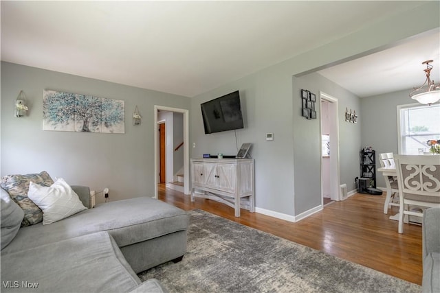 2930 Archwood Pl, Cuyahoga Falls, OH 44221 - living room featuring wood finished floors, stairs, and baseboards