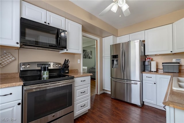 2930 Archwood Pl, Cuyahoga Falls, OH 44221 - kitchen with stainless steel appliances, dark wood finished floors, ceiling fan, white cabinets, and light countertops