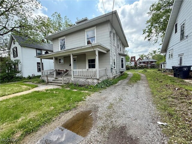 1017 Rice Ave, Lima, OH 45805 - american foursquare style home featuring covered porch and driveway