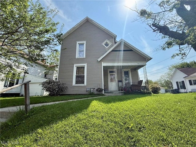 466 N Mcdonel St, Lima, OH 45801 - view of front of house with a porch and a front lawn