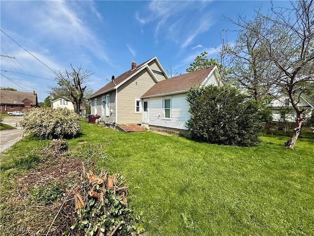 466 N Mcdonel St, Lima, OH 45801 - view of property exterior with a lawn