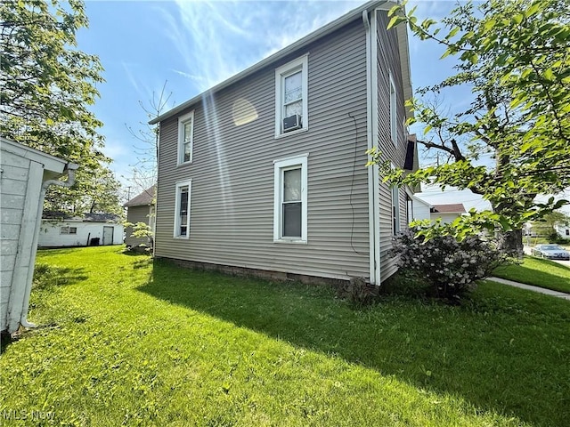 466 N Mcdonel St, Lima, OH 45801 - rear view of property featuring a yard