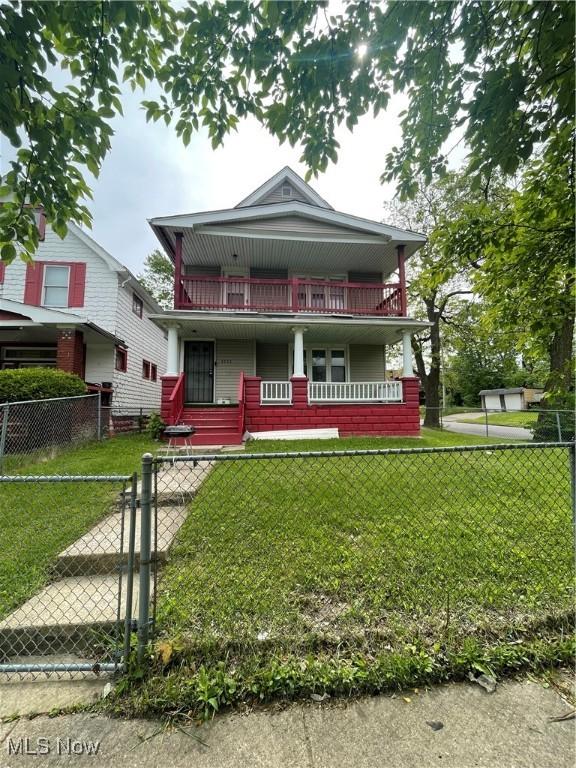 view of front of house with covered porch and a gate