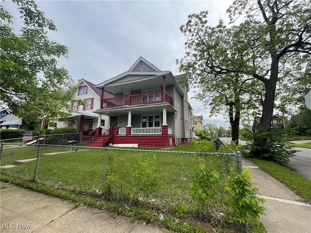 view of front of property featuring covered porch and a balcony