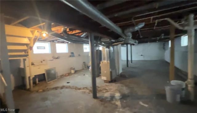 below grade area featuring heating unit