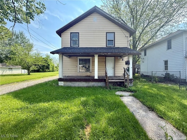 1026 N Central Ave, Lima, OH 45801 - american foursquare style home with covered porch and a shingled roof
