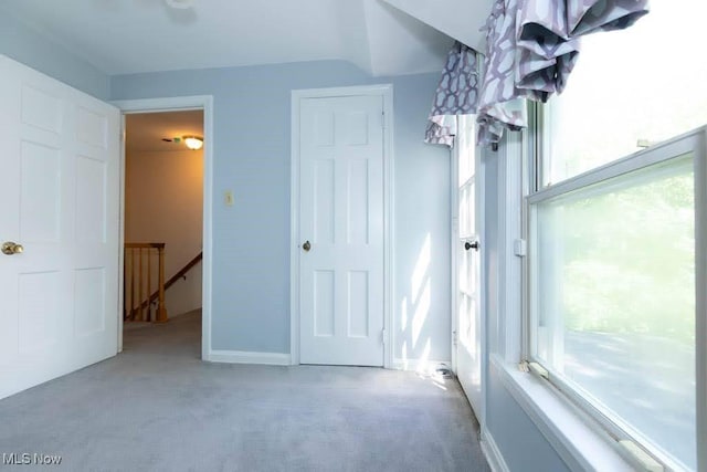 4020 Colony Rd, South Euclid, OH 44121 - unfurnished bedroom featuring carpet floors, multiple windows, and baseboards