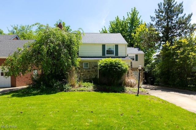 4020 Colony Rd, South Euclid, OH 44121 - view of front of home featuring a front yard and stone siding