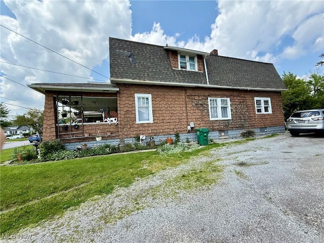 924 W Elm St, Lima, OH 45801 - view of property exterior with a shingled roof, a lawn, and asphalt driveway