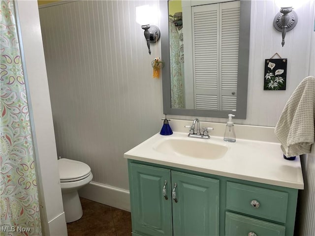 1605 E 46th St, Ashtabula, OH 44004 - full bath featuring tile patterned flooring, toilet, vanity, and baseboards