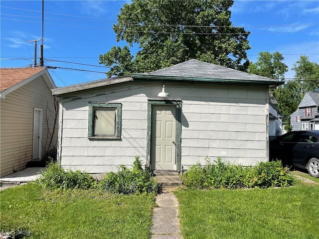 1605 E 46th St, Ashtabula, OH 44004 - view of front of house featuring a front yard and a shingled roof